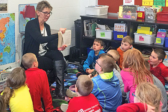 Carol McKinley reads to students