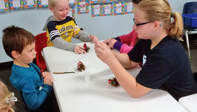 Youngsters make pinecone turkeys at Super Silly Saturday